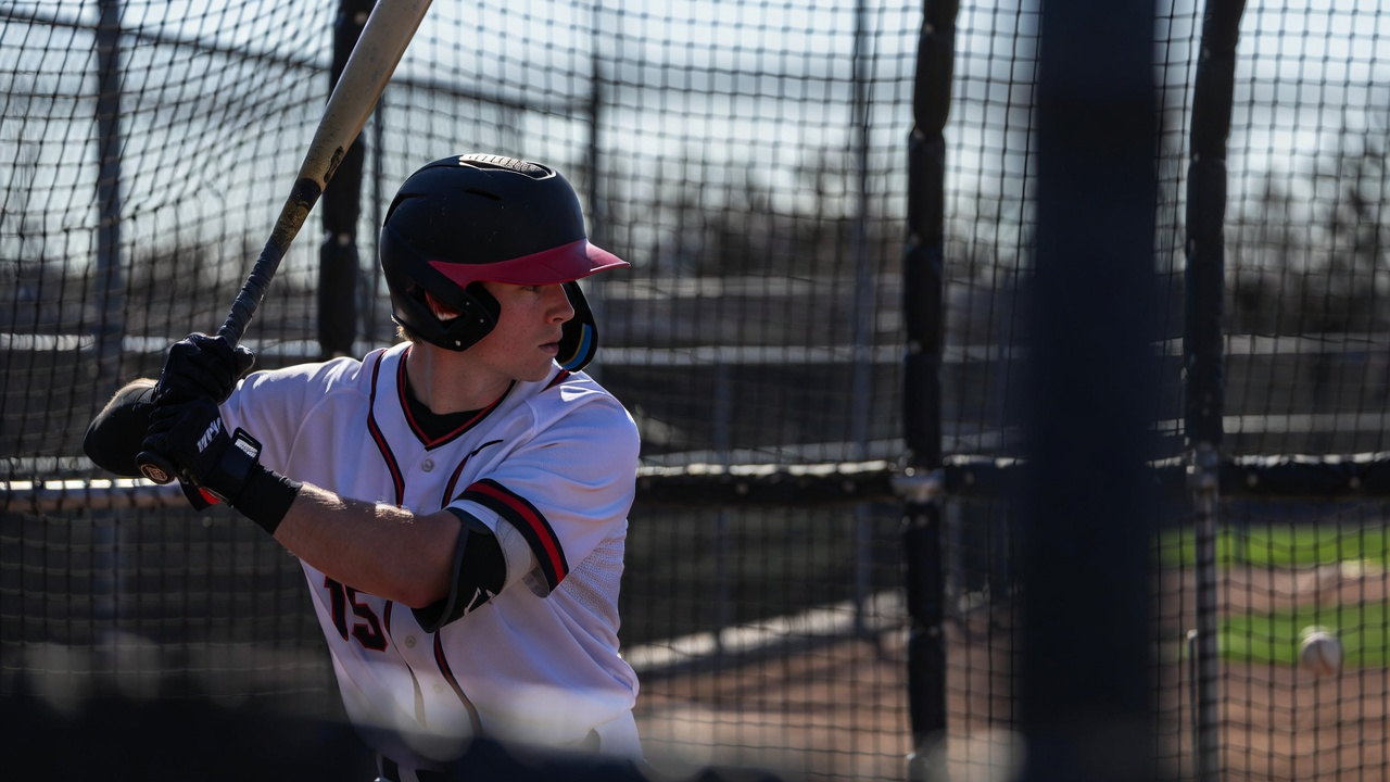 Baseball player in batting cage